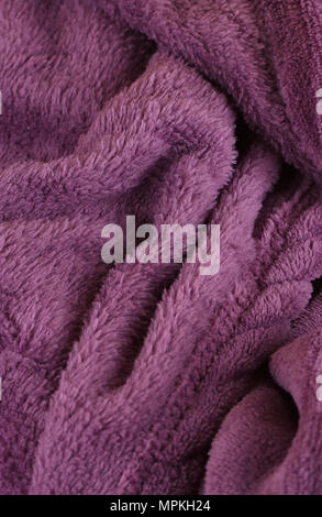 Dark purple bath fluffy towel or blanket Stock Photo