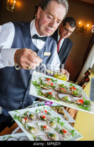 Montreal Canada,Quebec Province,Fairmont Queen Elizabeth,hotel,man men male,waiter waiters server employee worker workers working staff,hors d'oeuvres Stock Photo