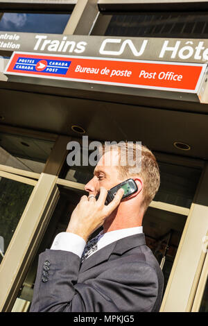 Montreal Canada,Quebec Province,Boulevard Rene Levesque,Gare Centrale,Central Train Station,adult adults man men male,menal,smartphone smartphones mob Stock Photo