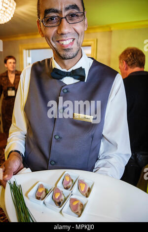 Montreal Canada,Quebec Province,Fairmont Queen Elizabeth,hotel,Mideastern man,male waiter,server,hors d'oeuvres reception,food,hospitality,Canada07070 Stock Photo