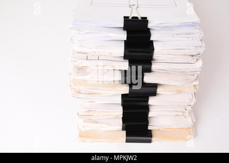 Paper stack storage and Black Paper Clip pace on white isolated background Stock Photo