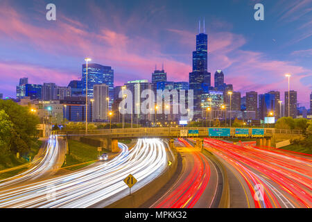 Chicago, Illinois, USA downtown skyline over highways at twilight. Stock Photo