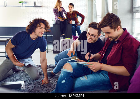 A group of young people students are discussed. Stock Photo