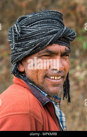 Nepalese man wearing a scarf, Close-up, Dhampus Mountain village, Nepal Stock Photo