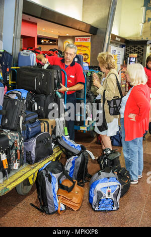 Canada,Canadian,Quebec Province,French language,bilingual speaking,Montreal,Gare Centrale,Central Train Station,schedule,ticketing,porter,luggage,suit Stock Photo