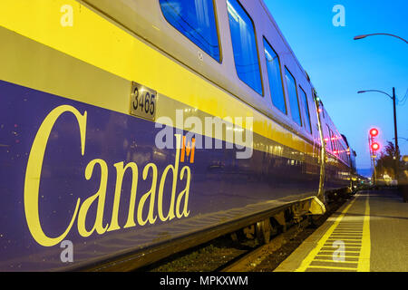 Canada,Canadian,North America Charny,VIA Rail train station,VIA Rail passenger car,platform,dusk,evening,Canada070708126 Stock Photo