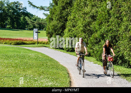 Quebec Canada,Parc du Bois de Coulonge,public park,couple,man men male,woman female women,bicycle,bicycling,riding,biking,rider,bike path,Canada070710 Stock Photo