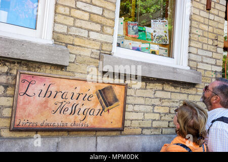 Quebec City Canada,Canadian,North America,American,Rue Saint Jean,Librairie Nelligan,bookstore,couple,adult,adults,window,shopping shopper shoppers sh Stock Photo