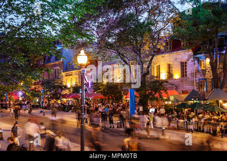 Quebec Canada,Grande Allee,Summer Festival,festivals fair,restaurant restaurants food dining cafe cafes,al fresco sidewalk outside tables,eating,night Stock Photo