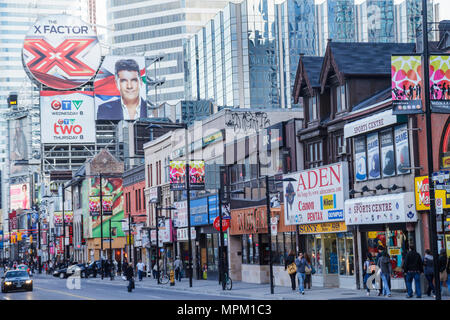 Toronto Canada,Yonge Street,Downtown Yonge,street scene,shopping shopper shoppers shop shops market markets marketplace buying selling,retail store st Stock Photo