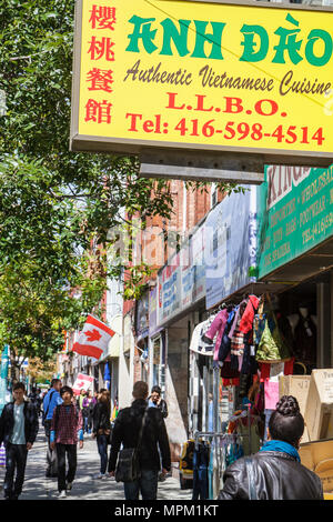 Toronto Canada,Spadina Avenue,Chinatown,ethnic neighborhood,street,sidewalk,sign,logo,Vietnamese cuisine,ethnic food,hanzi,Chinese characters,visitors Stock Photo