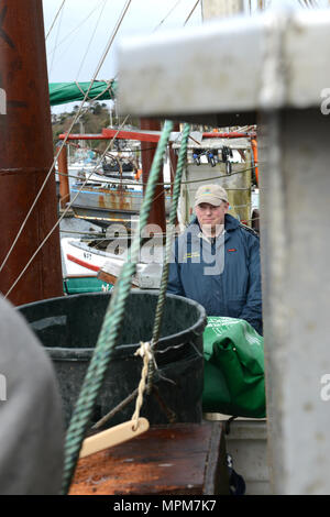 Mike Rudolph, a fishing vessel safety examiner from the Coast Guard's Marine Safety Unit Portland, evaluates a man overboard dril in Newport, Oregon Mar. 24, 2017. Rudolph, along with three other instructors, just completed an 18-hour drill conductor's course in which they taught local commercial fishermen how to conduct various emergency drills for the crews aboard their own vessels. U.S. Coast Guard photo by Petty Officer 1st Class Zac Crawford. Stock Photo