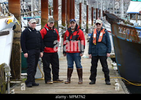 (L to R) Mike Rudolph, Steve Kee, Dan Cary and Ron Hilberger, all fishing vessel safety examiners from the Coast Guard's Marine Safety Unit Portland, take time for a group photo. The four men just completed an 18-hour drill conductor's course in which they taught local commercial fishermen how to conduct various emergency drills for the crews aboard their own vessels. U.S. Coast Guard photo by Petty Officer 1st Class Zac Crawford. Stock Photo