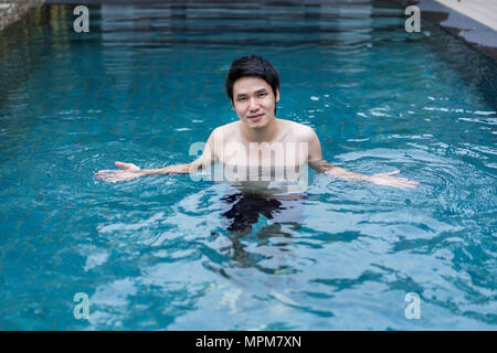 young man playing in the swimming pool Stock Photo