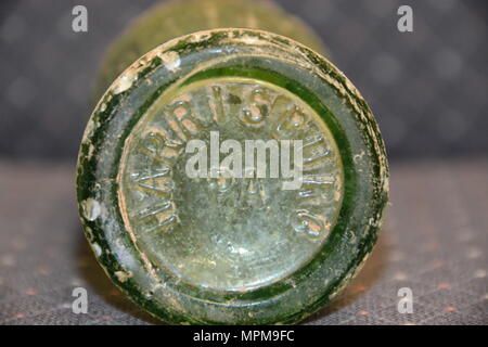 The digging from the sewer line upgrades has unearthed some of the installation’s past, like this old soda bottle from a Harrisburg, Pa. plant. Artifacts are donated to the Pennsylvania Military Museum on the installation. (U.S. Army National Guard photo by Maj. Angela King-Sweigart) Stock Photo