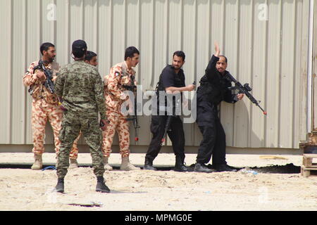 Civilian and military personnel from Kuwait, Saudi Arabia and the U.S. conducted counterterrorism drills as part of Eagle Resolve 2017 near Kuwait International Airport, March 28, 2017. Urban warfare specialists conducted search and rescue operations and responded to a mock vehicle explosion. Since 1999, Eagle Resolve - involving over 1,000 U.S. military personnel - has become the premier multi-national exercise between U.S. and Gulf Cooperation Council nations to collectively address the regional challenges in a low-risk setting. (Photo by U.S. Army Staff Sgt. Francis O’Brien) Stock Photo