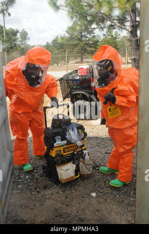 FORT GORDON FIRE DEPARTMENT TRAINING AREA, Fort Gordon, Ga., March 27, 2017- South Carolina Army National Guardsmen, representing the 43rd Civil Support Team, gathers their gear after they contain a stimulated biohazard lab during Vigilant Guard 17.    (U.S. Army National Guard photo by Spc. Isaiah Matthews/Released) Stock Photo