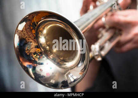 The trumpeter is playing on a silver trumpet. Trumpet players Stock ...