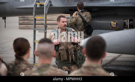 Lt. Col. Craig Andrle, 79th Expeditionary Fighter Squadron commander, speaks to squadron members after flying his 1,000th combat hour March 20, 2017 at Bagram Airfield, Afghanistan. There are only four F-16 Fighting Falcon pilots, lieutenant colonel and below, currently serving in the Air Force who have reached 1,000 combat hours. (U.S. Air Force photo by Staff Sgt. Katherine Spessa) Stock Photo