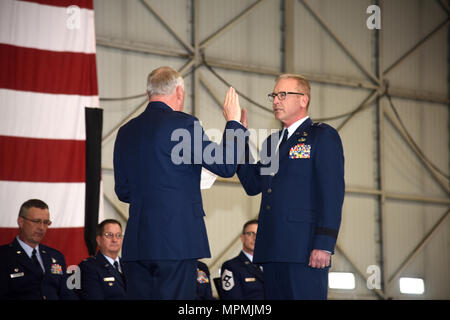 SIOUX FALLS, S.D. - Brig. Gen. Steven Warren, Assistant Adjutant General for Air, HQ SDANG, administered the oath of office to Brig. Gen. Joel DeGroot, during a transfer of authority ceremony at Joe Foss Field April 1st.  DeGroot previously served as the 114TH Maintenance group commander.  (U.S. Air National Guard photo by Staff Sgt. Duane Duimstra/Released) Stock Photo
