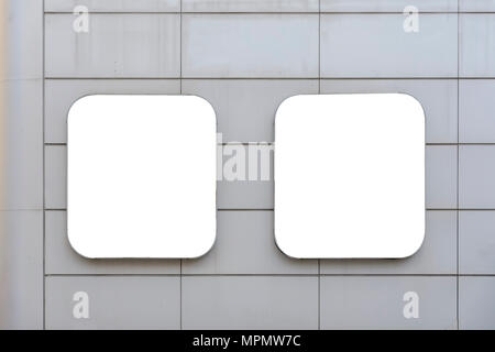 two blank billboard on a wall between lines Stock Photo