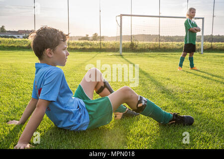 Two young football players on football ground Stock Photo