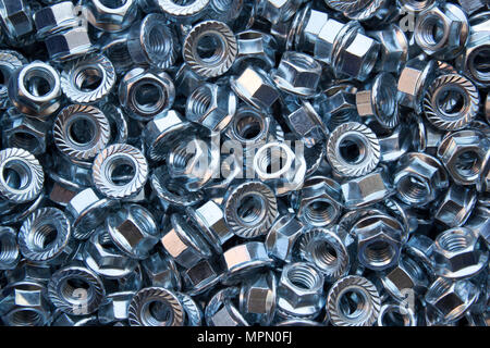 big pile of screw nuts as background Stock Photo
