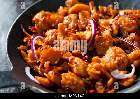 Vegetarian 'Pulled pork' made of soy meat with sweet potatoes and Barbecue sauce in pan Stock Photo