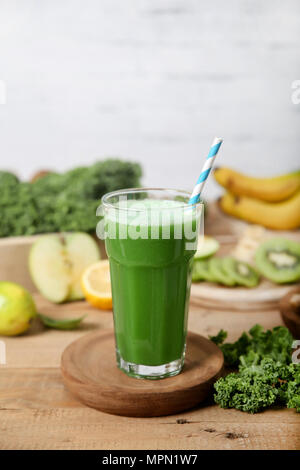 Green smoothie surrounded by ingredients Stock Photo