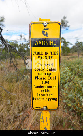 Roadsign warning about underground cables, Far North Queensland, FNQ, QLD, Australia Stock Photo