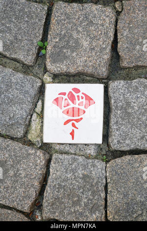 rose route in Hildesheim Germany, paving stones with ceramic plaques with rose symbol marking self-guided sightseeing tour Stock Photo