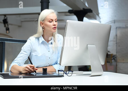 Interior decorator. The designer designs on a computer. Stock Photo
