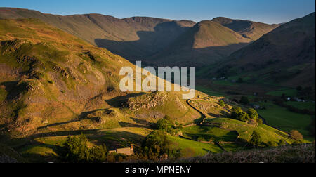 Martindale from the slopes of Hallin Fell as the late afternoon sun sets on the slopes ofSteel Knotts Stock Photo