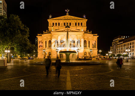 Night shot of the Old Opera House Alte Oper in Frankfurt Main in Springtime with Opernplatz fountain and walking people. Frankfurt -  Germany on May,  Stock Photo