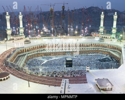 Muslims Prayer Around AlKaaba in Mecca, Saudi Arabia, Aerial View Stock Photo
