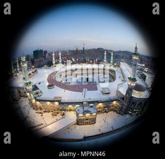 Prayer and Tawaf - circumambulation - of Muslims Around AlKaaba in Mecca, Saudi Arabia, Aerial Top View Stock Photo