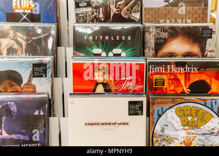 BUCHAREST, ROMANIA - APRIL 22, 2018: Vinyl Record Cases Of Famous Music Bands For Sale In Music Store Stock Photo