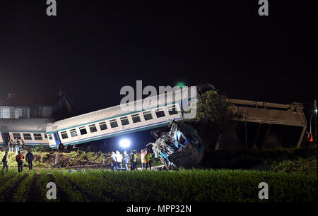 Rome, Italy. 24th May, 2018. Rescuers work at the site where a regional train crashed into a heavy goods vehicle on a railway line connecting the cities of Turin and Ivrea, Italy, on May 24, 2018. At least two people died and eighteen were injured in a train accident in the northwest Piedmont region of Italy, the country's emergency authorities said on Thursday. Credit: Xinhua/Alamy Live News Stock Photo