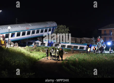 Rome. 24th May, 2018. Rescuers work at the site where a regional train crashed into a heavy goods vehicle on a railway line connecting the cities of Turin and Ivrea, Italy, on May 24, 2018. At least two people died and eighteen were injured in a train accident in the northwest Piedmont region of Italy, the country's emergency authorities said on Thursday. Credit: Xinhua/Alamy Live News Stock Photo