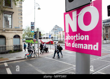 24 May 2018, Ireland, Dublin: Pedstrians walk past a campaign poster which calls on citizens to vote with 'No' against the lifting of the ban on abortion on the final day of campaigning before the Referendum on repealing the 8th Amendment to the Irish Constitution. Credit: dpa picture alliance/Alamy Live News Stock Photo