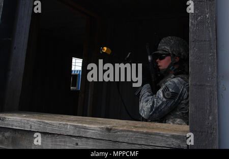 Staff Sgt. Katelyn McHale, 569th U.S. Forces Police Squadron desk sergeant, posts at a window to watch for opposing forces during the urban operations portion of the 435th Security Forces Squadron’s Ground Combat Readiness Training Center’s Security Operations Course on U.S. Army Garrison Baumholder, Germany, April 4, 2017. McHale and other students had a mission to tactically enter a mock village, gain intelligence from the village leader, and make it back to their base. Airmen assigned to the 86th SFS, 422nd SFS, 100th SFS, and 569th USFPS participated in the course. (U.S. Air Force photo by Stock Photo