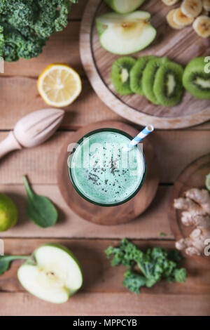 Green smoothie surrounded by ingredients Stock Photo
