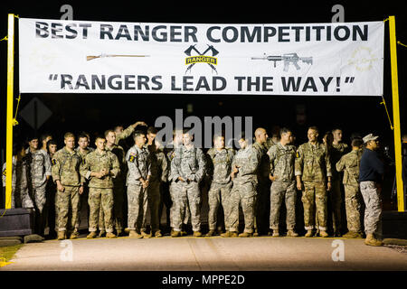 U.S. Army Rangers begin the 34th annual David E. Grange Jr. Best Ranger Competition at Ft. Benning, Ga., Apr. 7, 2017. The Best Ranger competition is a three-day event consisting of challenges to test competitor's physical, mental, and technical capabilities, and places the military's best two-man Ranger teams against each other to compete for the title of Best Ranger. (U.S. Army photo by Staff Sgt. Justin P. Morelli / Released) Stock Photo