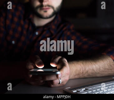 Man using smartphone, close-up Stock Photo