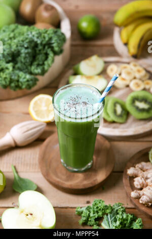 Green smoothie surrounded by ingredients Stock Photo