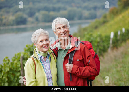 Germany, Rheingau, happy senior couple hiking Stock Photo