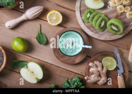 Green smoothie surrounded by ingredients Stock Photo
