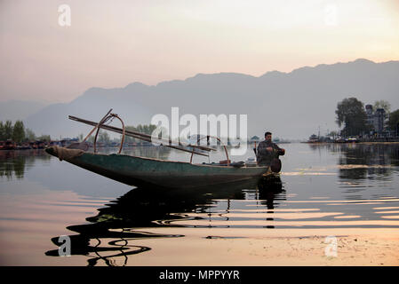 Man sitting on Sikhara in Srinagar, Dal Lake Stock Photo