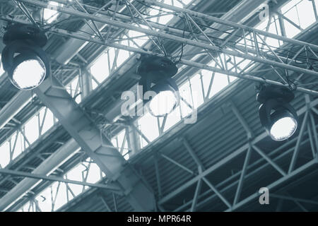 Set of spot lights on a rail hanging from the ceiling Stock Photo