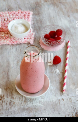 Glass bottle of raspberry smoothie Stock Photo